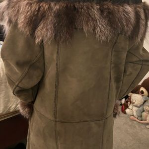 This is a woman’s shearling jacket. Leather and fur.
